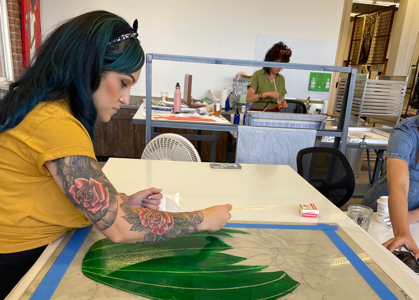 Woman creating artwork at Xico